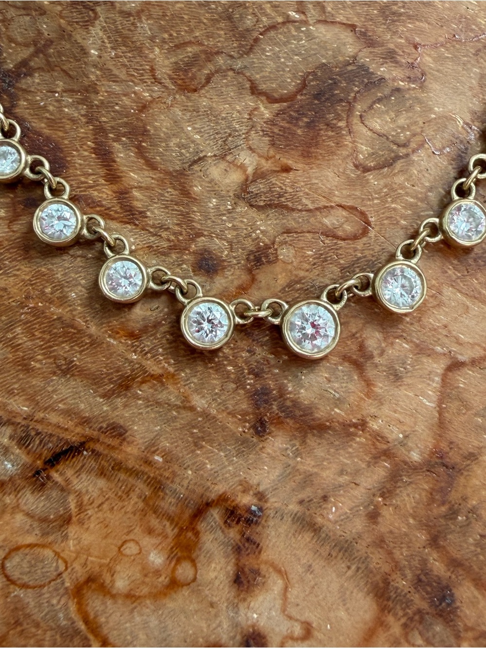 Genuine Diamond station necklace with bezel set natural diamonds and 14K gold.